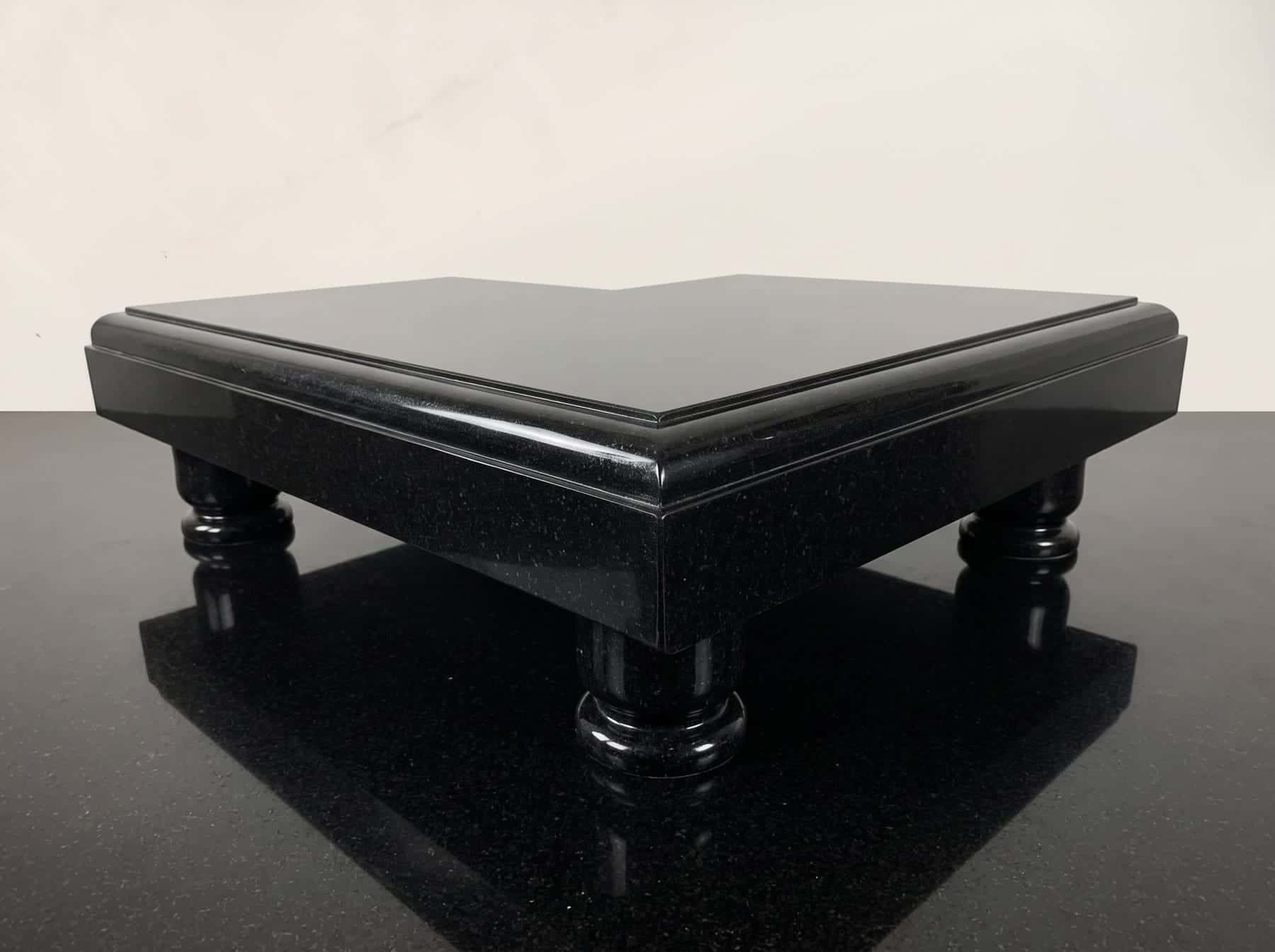 Low black granite chowki table with turned legs